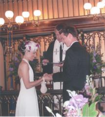 Custom bridal headpiece of ivory and purple feathers